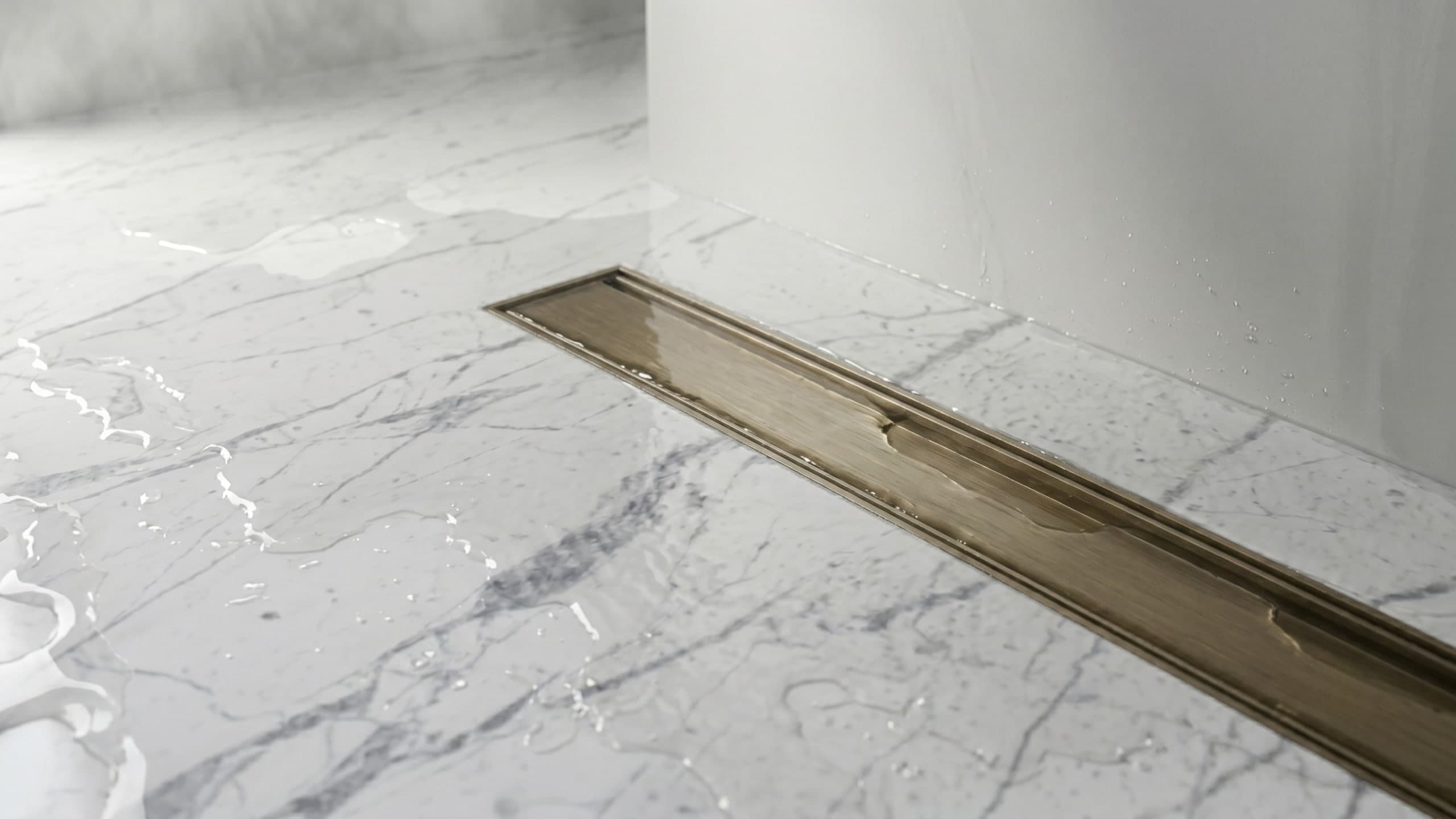 Auhna linear drain set flush in a marble bathroom floor